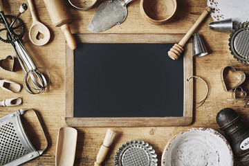 Old school slate surrounded by vintage kitchenware