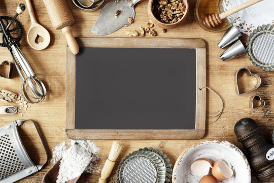 Vintage Baking Utensils Surrounding A School Slate