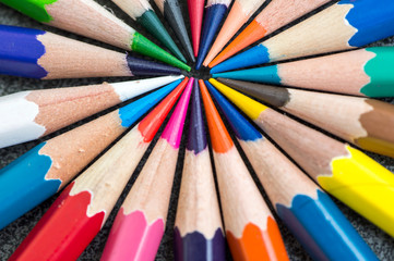 Fototapeta premium closeup of multicolored pencils on gray background