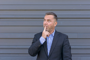Portrait of mature thoughtful man wearing jacket