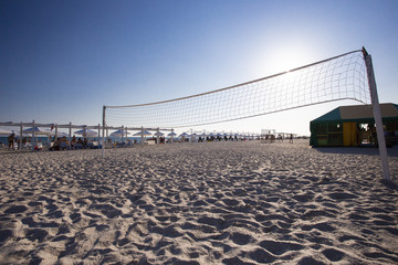 beach volleyball net on the seashore on the sunset