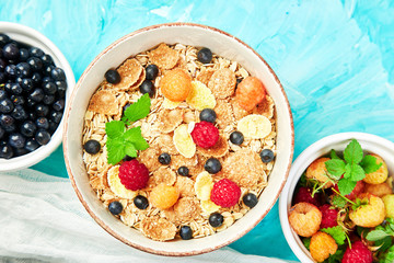 Healthy vegetarian breakfast. Oatmeal, granola with raspberries
