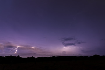 Sky background and lightning bolt at night