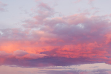 bright pink clouds on a blue sky at the sunset