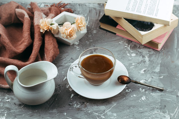 still life with cup of drink and books