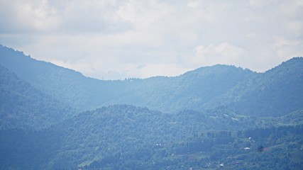 Mountain peak range landscape. Green mountain range view. Mountain peak blue sky white clouds panorama