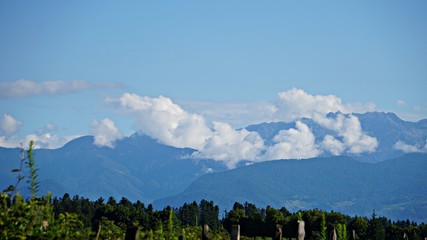 beautiful view of the mountains, clouds, town.