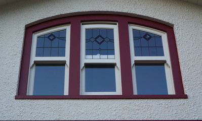 Curved window in red brown color