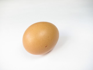 One chicken egg on white background