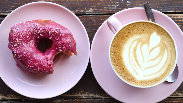 Fresh Vegan Donut With Coffee Latte On Table. Top View.