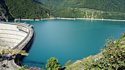 Obraz na płótnie Canvas beautiful blue lake on a dam, a hydroelectric power station.