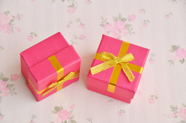 gift box with ribbon and bow on red background