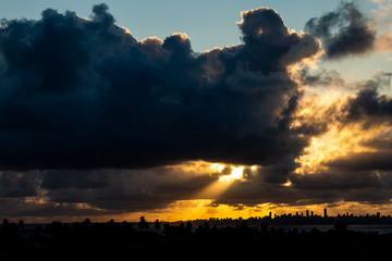 The silhouettes of distant buildings are outlined.