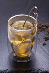 Double walled glass with tea and stainless steel tea infuser