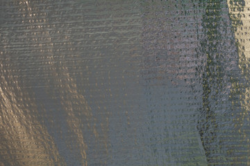 Steel packed with foil. Reinforced foil film. Vintage Creative Background.