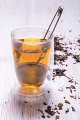 Double walled glass with tea and stainless steel tea infuser