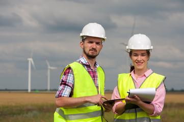 Fototapeta premium Concept of engineers and windmills