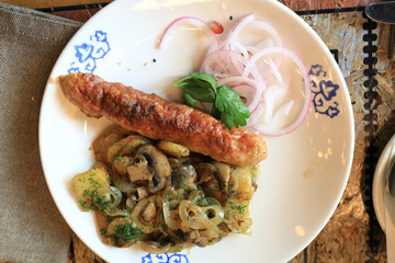 Lyulya kebab with fried mushrooms