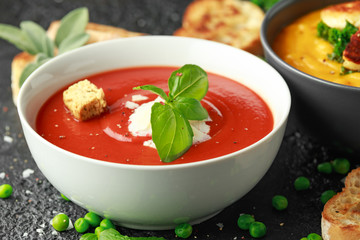 Tomato and fresh basil soup with garlic, cracked pepper corns, served with parmesan cheese, toast bread