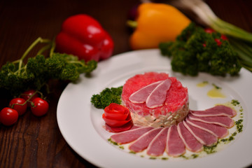 Cutting meat and vegetable salad
