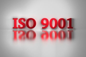 Red letters of ISO 9001 quality standard for a quality management system reflected on the white surface. ISO 9001 on white background. 3D illustration.