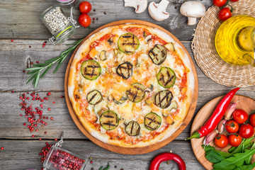 Fototapeta na wymiar Pizza with tomatoes, mozzarella cheese. Delicious italian pizza