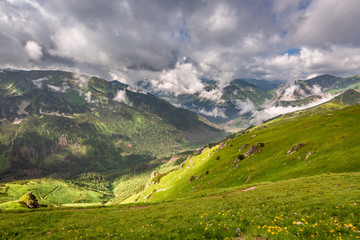 Fototapeta na wymiar View from the top of Kasprowy Wierch to green valley