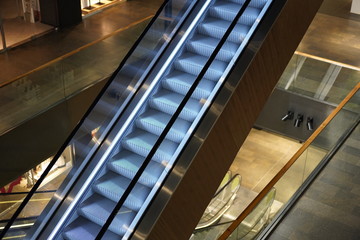 Illuminated escalator in a shopping mall