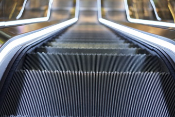 Illuminated escalator in a shopping mall