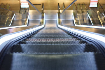 Illuminated escalator in a shopping mall