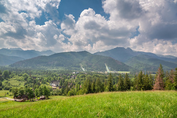 Fototapeta premium Mount Giewont and ski jump in cloudy, Poland