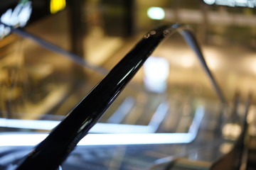 Illuminated escalator in a shopping mall