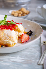 Close up view of beautiful elegant sweet dessert, Napoleon, served on the plate. Beautiful decoration, restaurant dish, ready to eat. Tea time, cozy atmosphere.