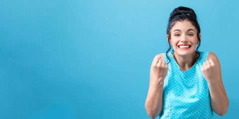 Successful young woman on a solid background