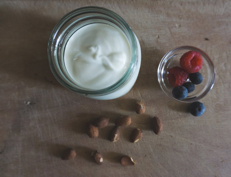 Flat Lay Of A Non Dairy Yogurt Made With Almond Milk And Berries