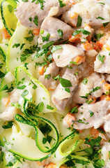 turkey stewed with vegetables garnished with parboiled marrow strips and decorated with parsley