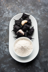 cooked Water chestnut with flour or powder, also known as singada/singara or shingada peeth, selective focus