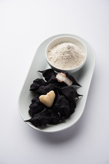 cooked Water chestnut with flour or powder, also known as singada/singara or shingada peeth, selective focus