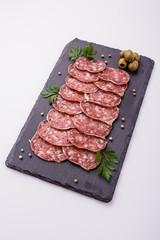 Saucisson sec delicious french salami on a white background