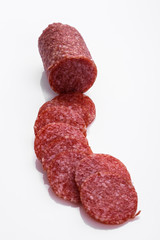 delicious sliced salami on a white background