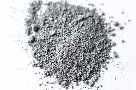 Natural colored pigment powder close up, matt grey eyeshadow or powder mica pigment on a white background