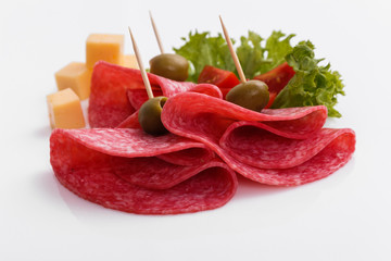 delicious sliced salami on a white background