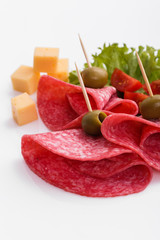 delicious sliced salami on a white background