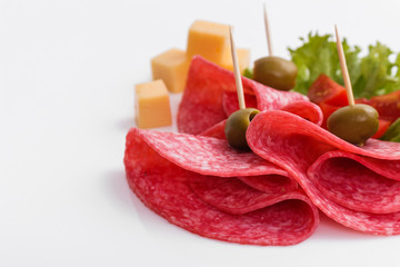 delicious sliced salami on a white background