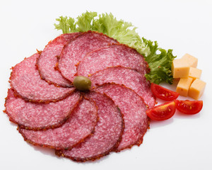 delicious sliced salami on a white background