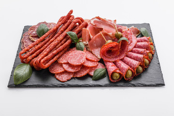 Cold smoked meat plate on a white background