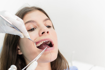 Young teen girl at dentist