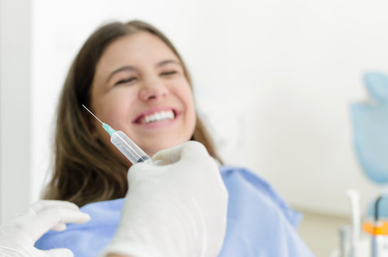 Happy patient having anesthesia at dentist