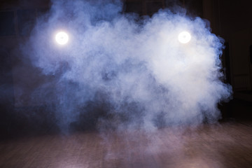 Background of an empty room with smoke and light. Dark blue abstract background in dance class