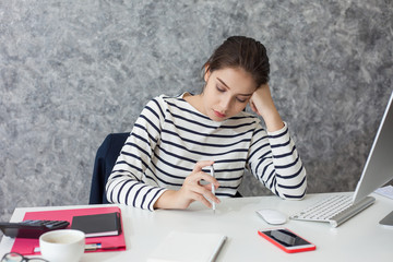 Feeling tired. Beautiful Young woman feeling stress from work.